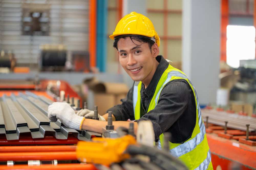 A worker doing steel fabrication.